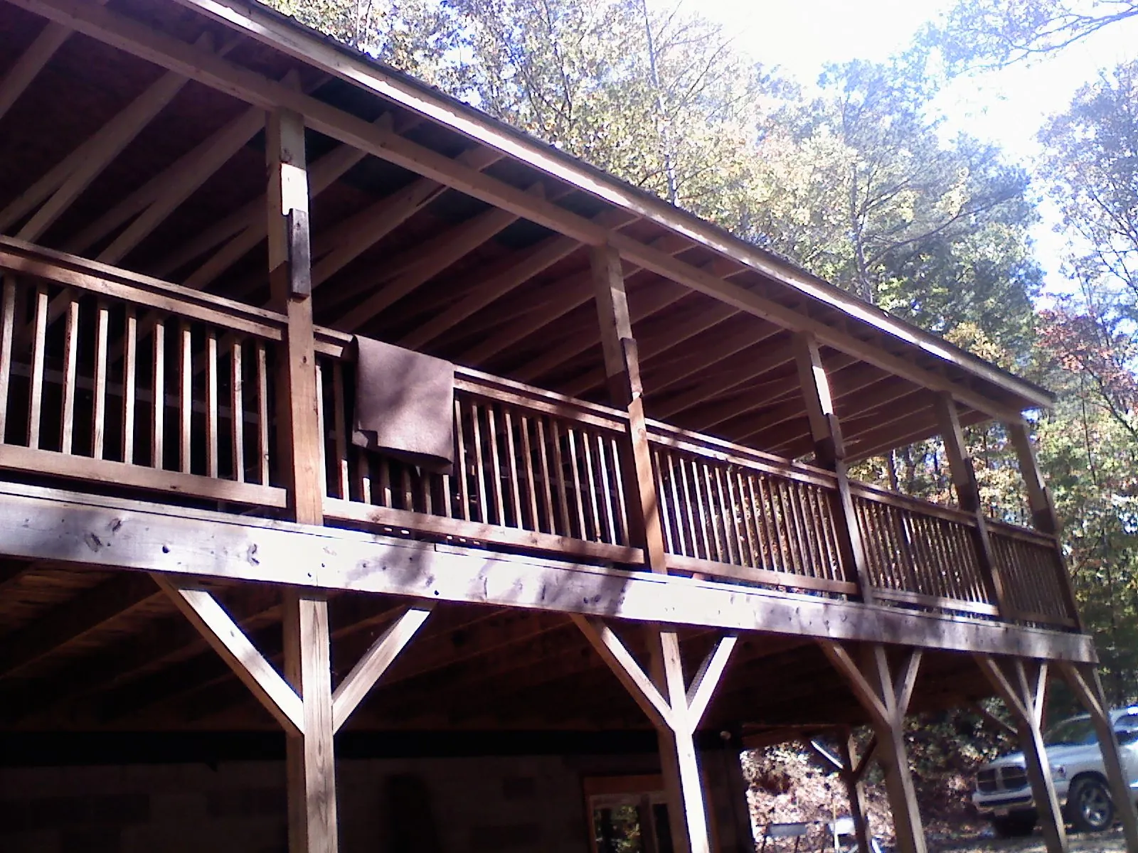 Timber framing under a new elevated porch and deck — Roof Leak Repair in Auburn Hills by Roofing Brothers